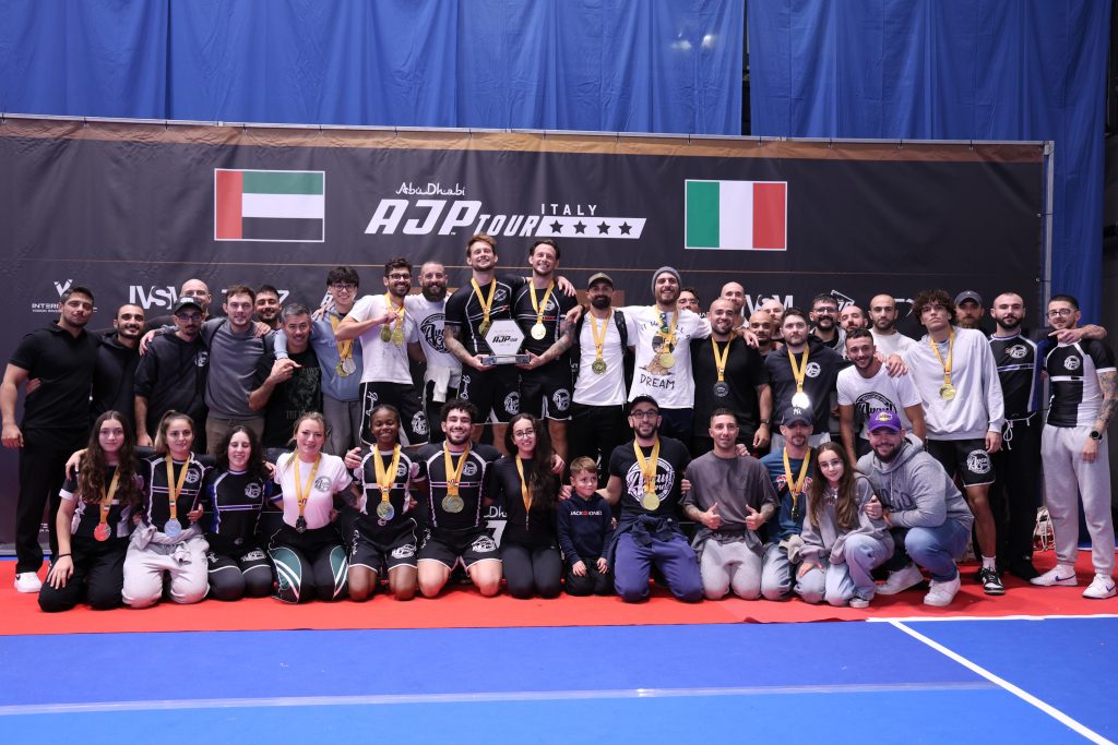 “Avant-Garde BJJ Malta team celebrating victory at the AJP Italian National Championship 2025 in Milan, holding the Best Team Trophy.”